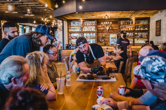 Leondard from Truth BBQ shares table with friends